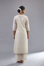 Off white silk chanderi straight kurta set with all over dori and silk thread embroidery.