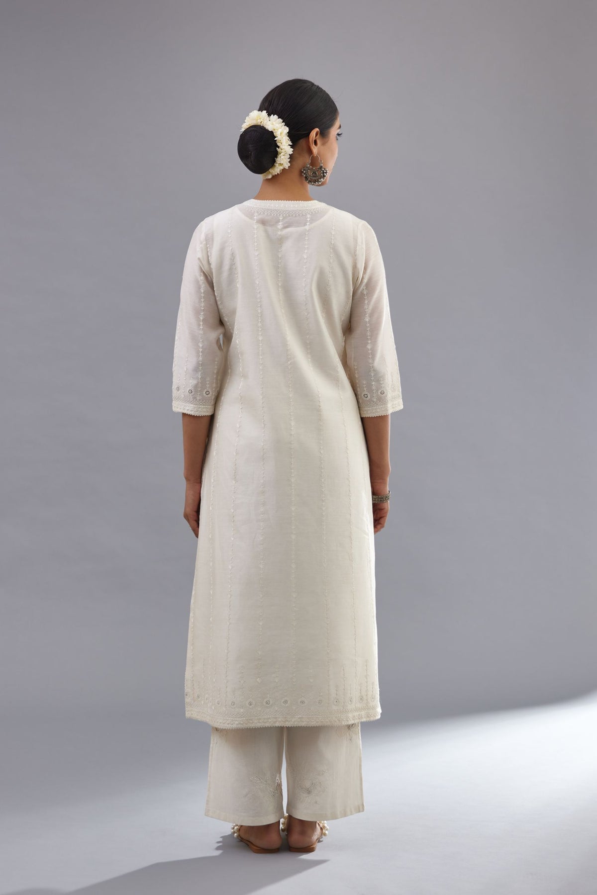 Off white silk chanderi straight kurta set with all over dori and silk thread embroidery.