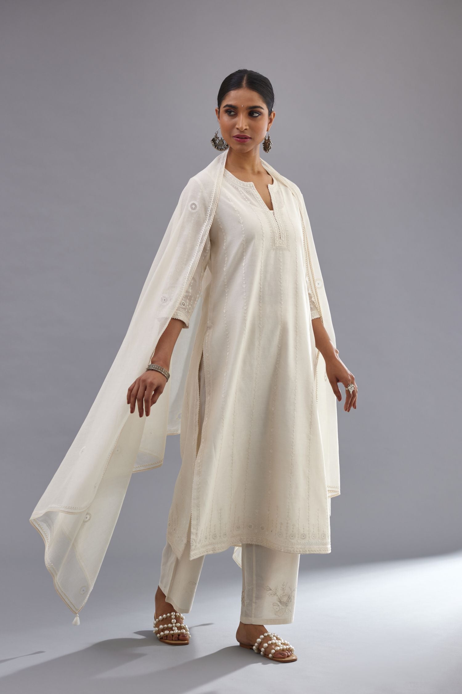 Off white silk chanderi straight kurta set with all over dori and silk thread embroidery.
