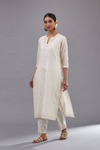 Off white silk chanderi straight kurta set with dori and silk thread embroidery at the neck, armholes, hem and sleeve cuffs.