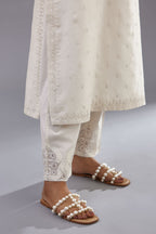 Off white silk chanderi straight kurta set with dori and silk thread embroidery at the neck, armholes, hem and sleeve cuffs.