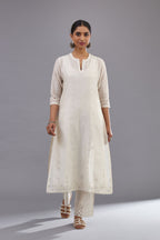 Off white silk chanderi straight kurta set with dori and silk thread chhari - stripes, all over and heavier butas at hem.