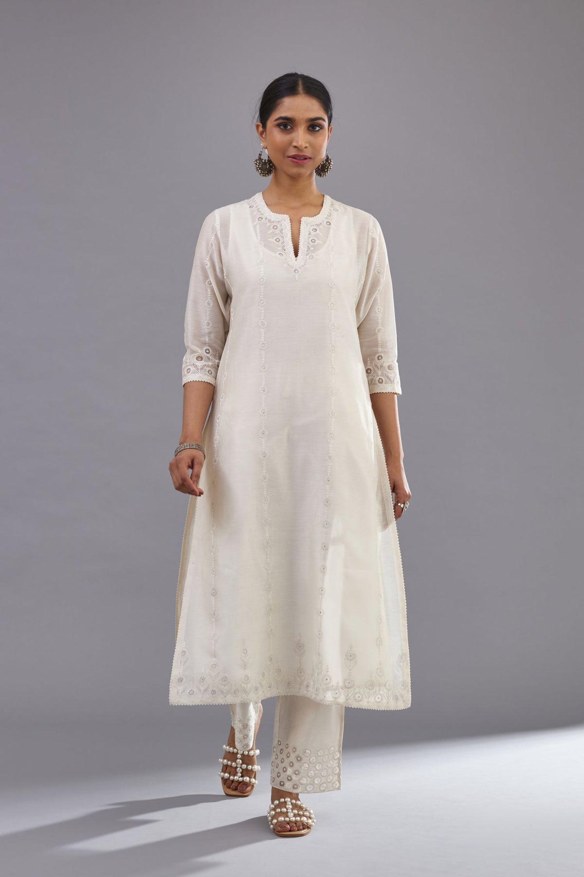 Off white silk chanderi straight kurta set with dori and silk thread chhari - stripes, all over and heavier butas at hem.