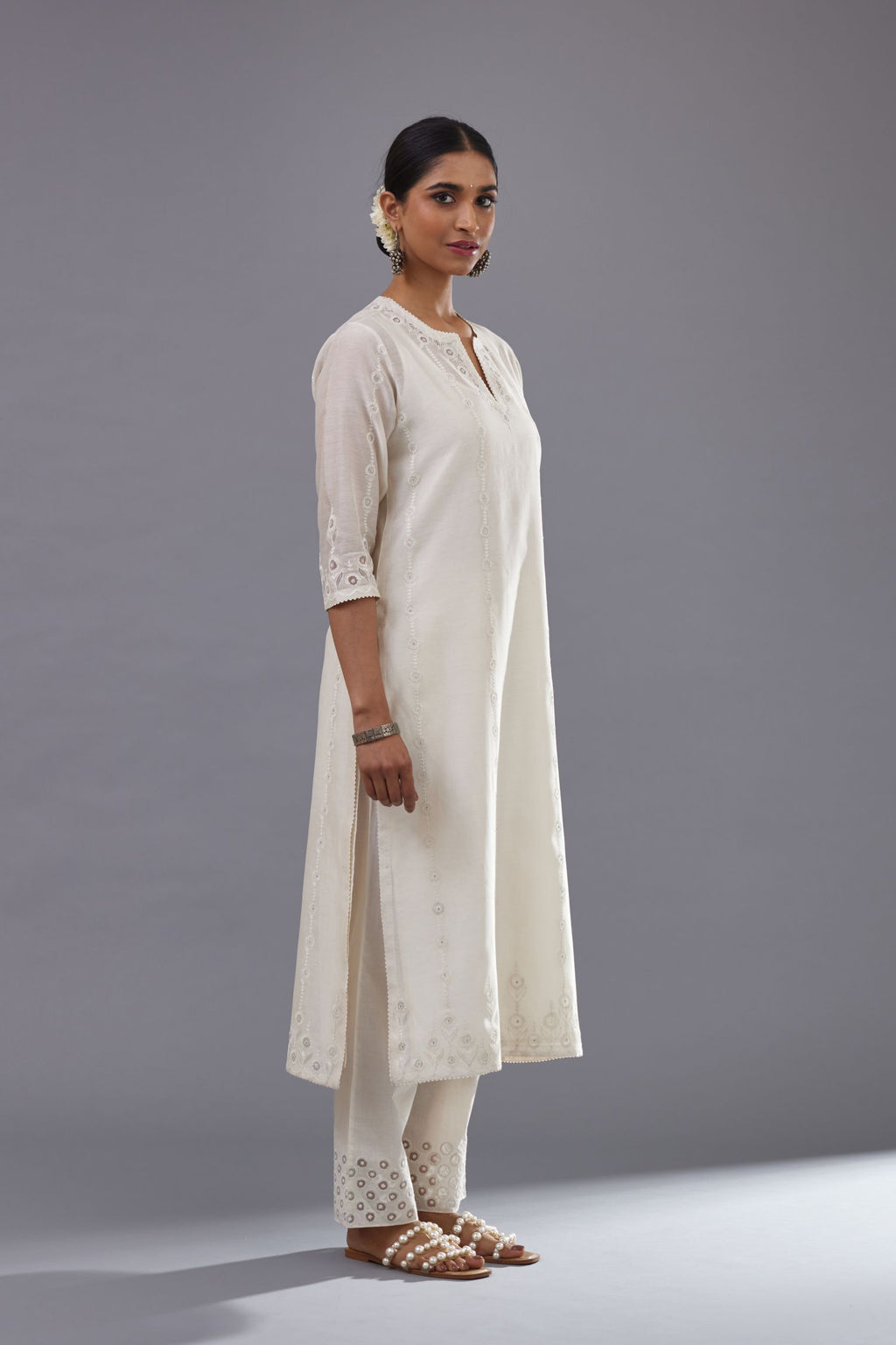 Off white silk chanderi straight kurta set with dori and silk thread chhari - stripes, all over and heavier butas at hem.