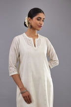 Off white silk chanderi straight kurta set with dori and silk thread chhari - stripes, all over and heavier butas at hem.