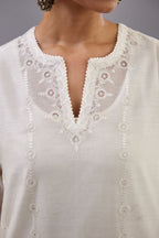 Off white silk chanderi straight kurta set with dori and silk thread chhari - stripes, all over and heavier butas at hem.
