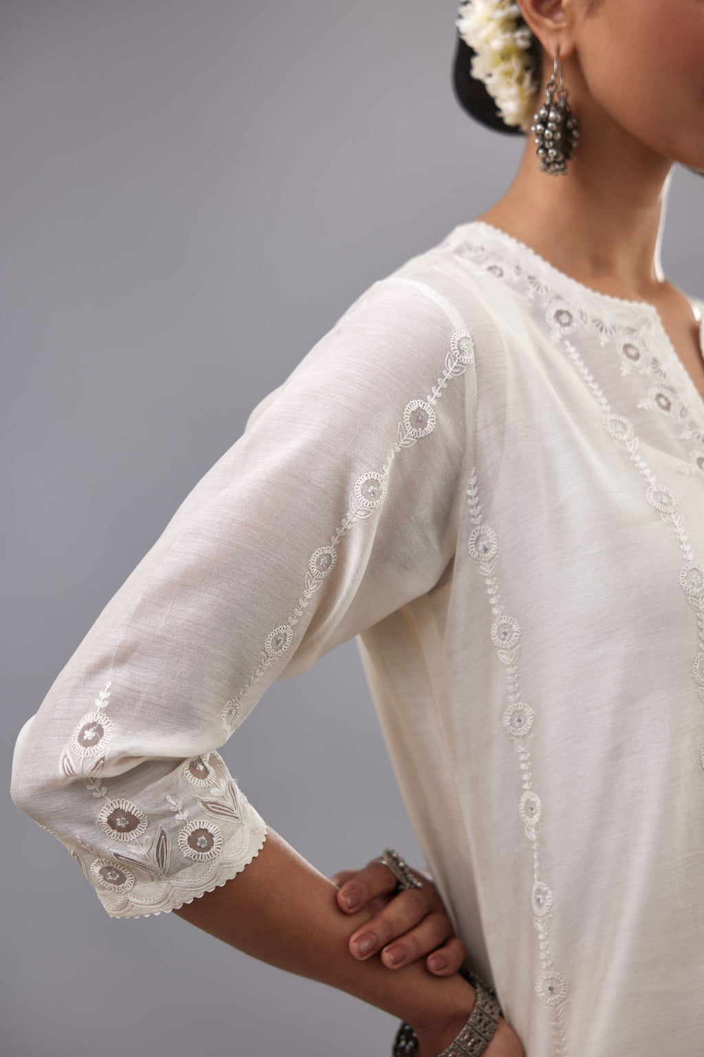 Off white silk chanderi straight kurta set with dori and silk thread chhari - stripes, all over and heavier butas at hem.