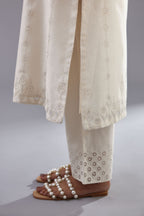 Off white silk chanderi straight kurta set with dori and silk thread chhari - stripes, all over and heavier butas at hem.