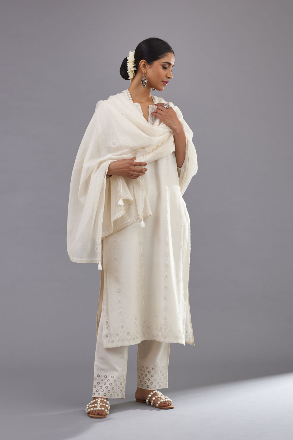 Off white silk chanderi straight kurta set with dori and silk thread chhari - stripes, all over and heavier butas at hem.
