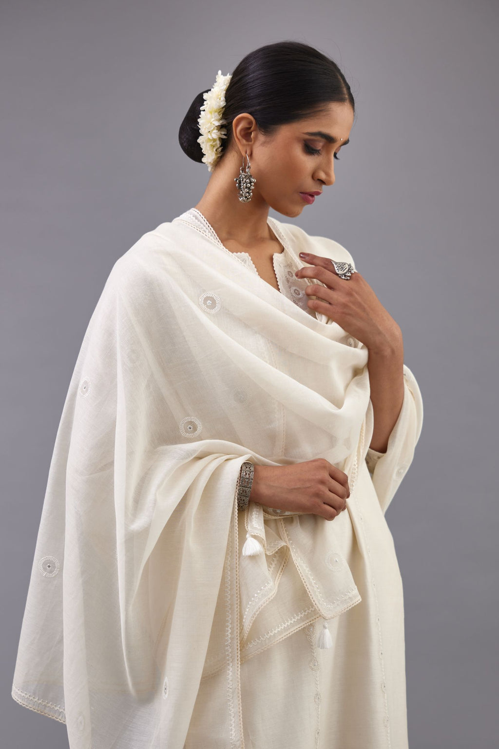 Off white silk chanderi straight kurta set with dori and silk thread chhari - stripes, all over and heavier butas at hem.