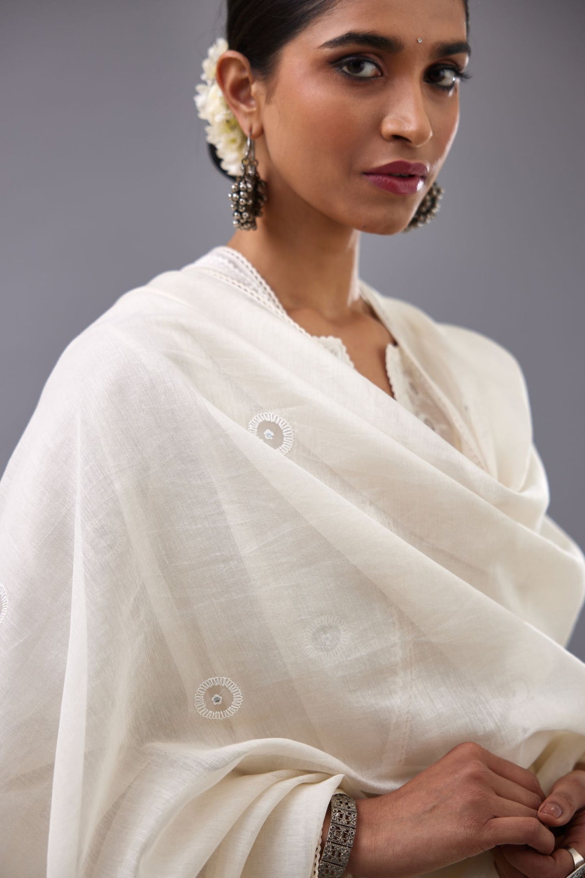 Off white silk chanderi straight kurta set with dori and silk thread chhari - stripes, all over and heavier butas at hem.