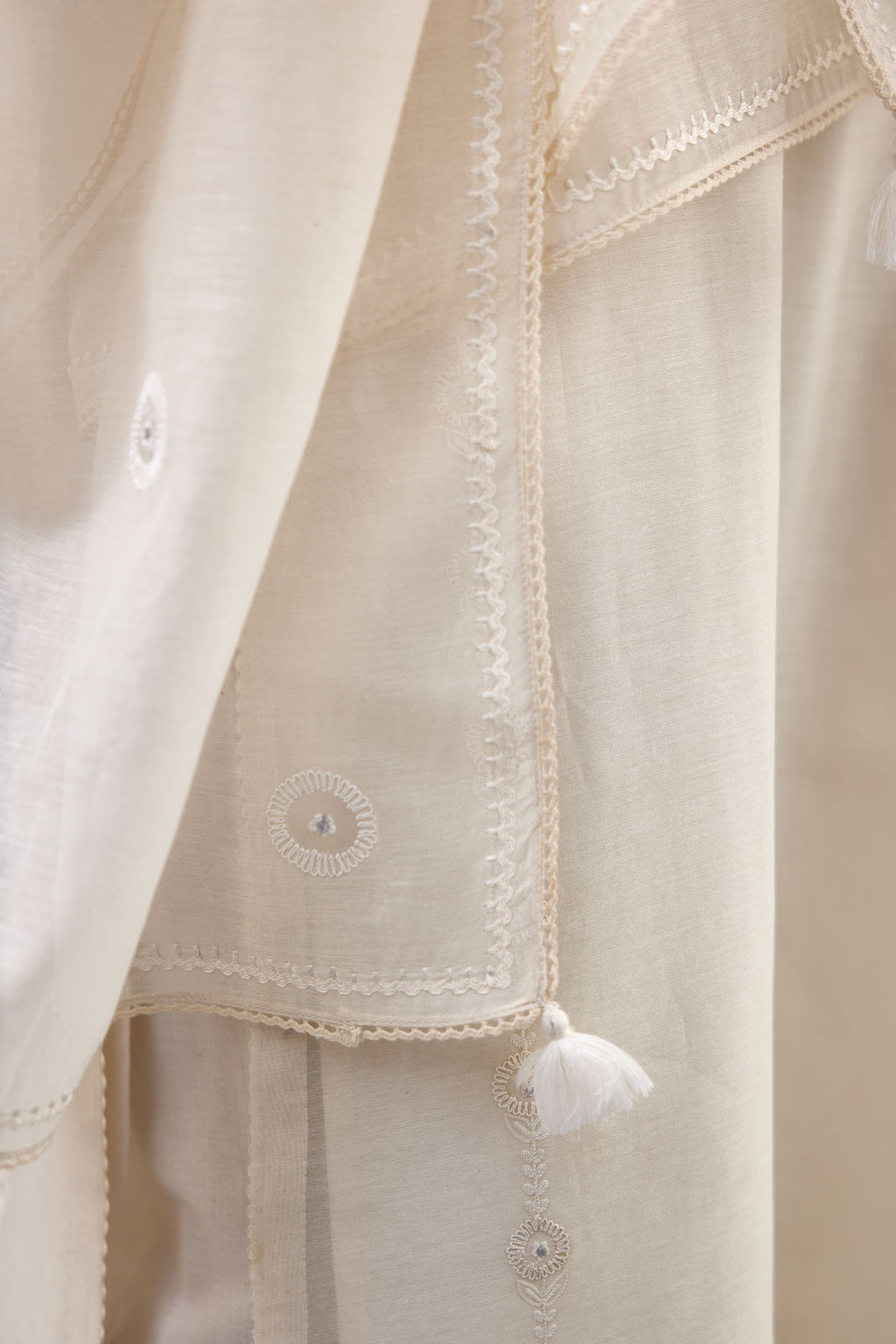 Off white silk chanderi straight kurta set with dori and silk thread chhari - stripes, all over and heavier butas at hem.