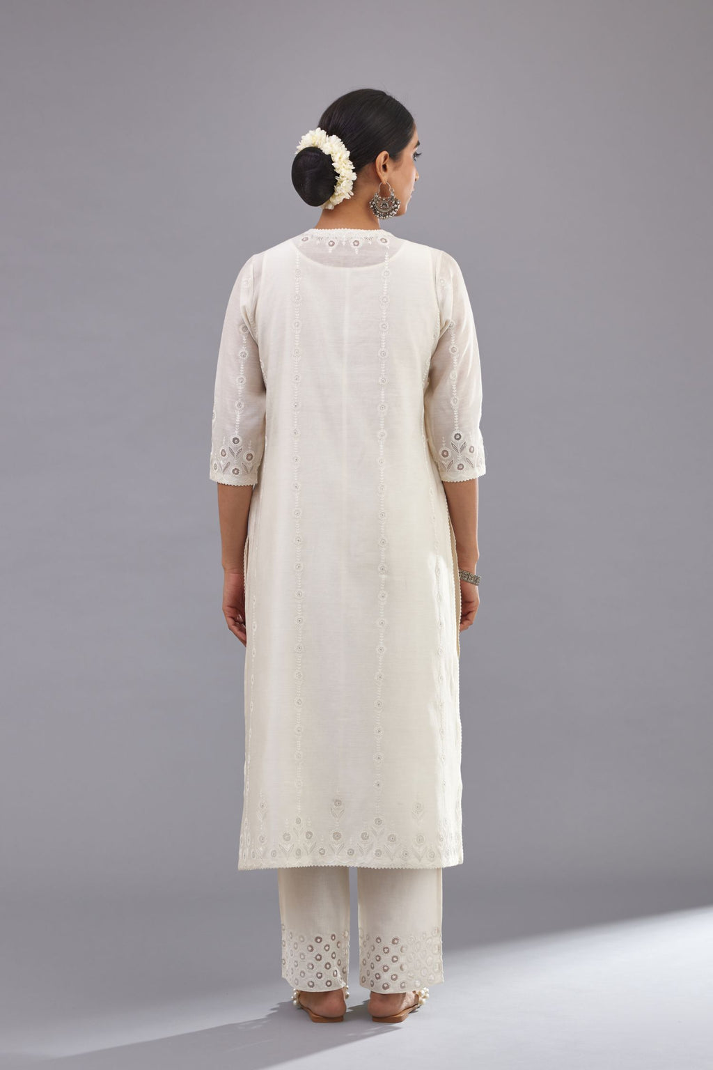 Off white silk chanderi straight kurta set with dori and silk thread chhari - stripes, all over and heavier butas at hem.