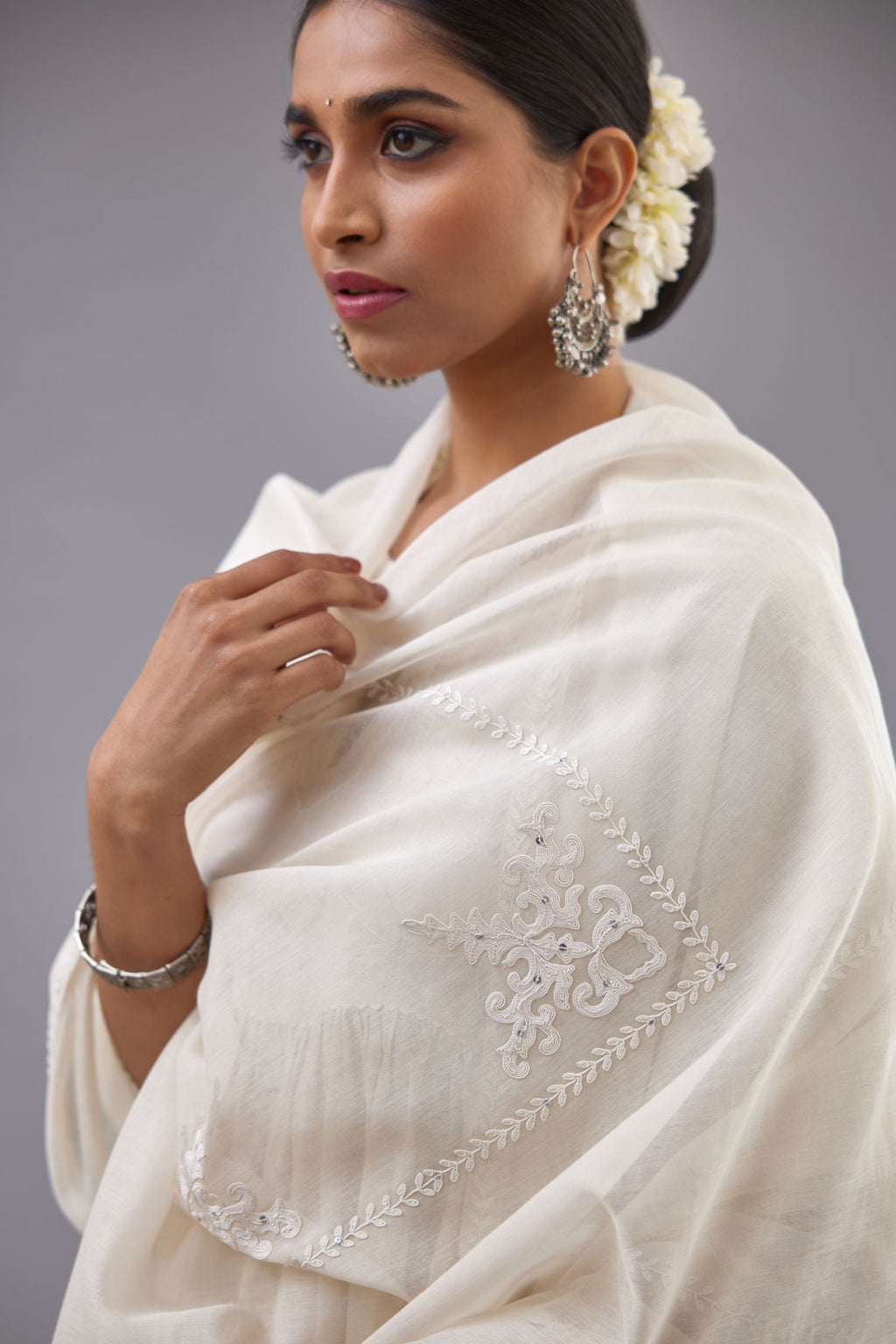 Handspun handwoven cotton  kurta set with wavy empire waistline and gathers, highlighted with all-over tonal colored thread embroidery and ric-rac detail.