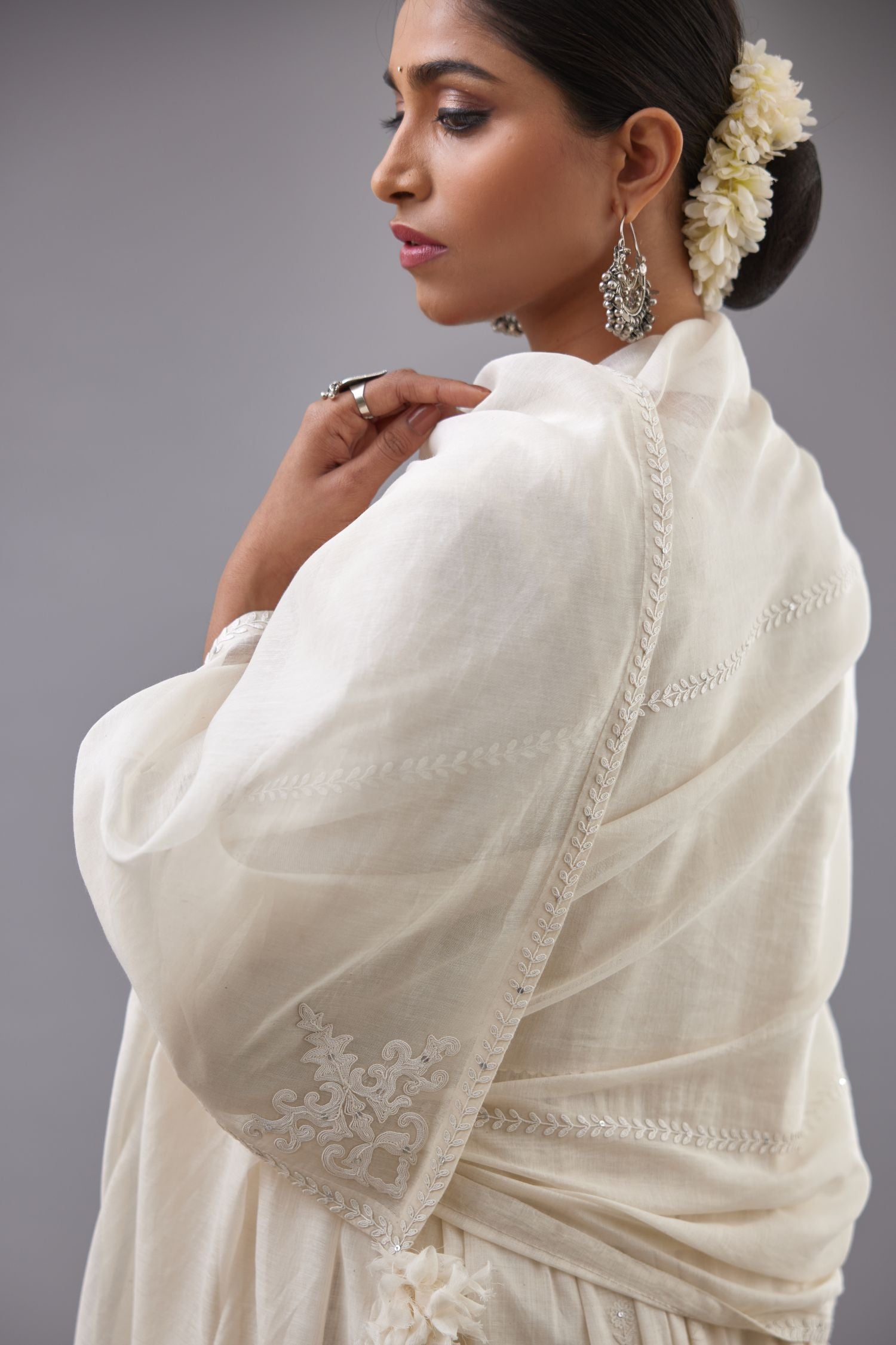 Handspun handwoven cotton  kurta set with wavy empire waistline and gathers, highlighted with all-over tonal colored thread embroidery and ric-rac detail.