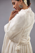Handspun handwoven cotton  kurta set with wavy empire waistline and gathers, highlighted with all-over tonal colored thread embroidery and ric-rac detail.