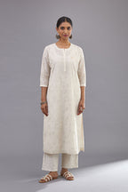 Off-white Handspun handwoven cotton kurta set with all-over jaal embroidery and small assorted flowers embroidery at side panells, highlighted with sequins handwork.
