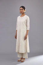 Off-white Handspun handwoven cotton kurta set with all-over jaal embroidery and small assorted flowers embroidery at side panells, highlighted with sequins handwork.