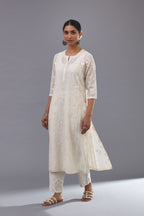 Off-white cotton chanderi kurta set with all-over jaal embroidery and small assorted flowers embroidery at side panells, highlighted with sequins handwork.