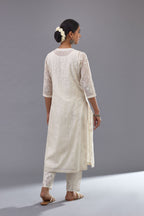 Off-white cotton chanderi kurta set with all-over jaal embroidery and small assorted flowers embroidery at side panells, highlighted with sequins handwork.