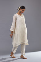 Off-white cotton chanderi A-line kurta set with all-over assorted flowers embroidery, highlighted with sequins handwork.
