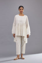 Off white cotton easy fit top with flared sleeves and hem, paired with off white cotton comfortable fit pant with all-over elasticated waistband.