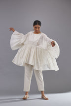Off white cotton easy fit top with flared sleeves and hem, paired with off white cotton comfortable fit pant with all-over elasticated waistband.