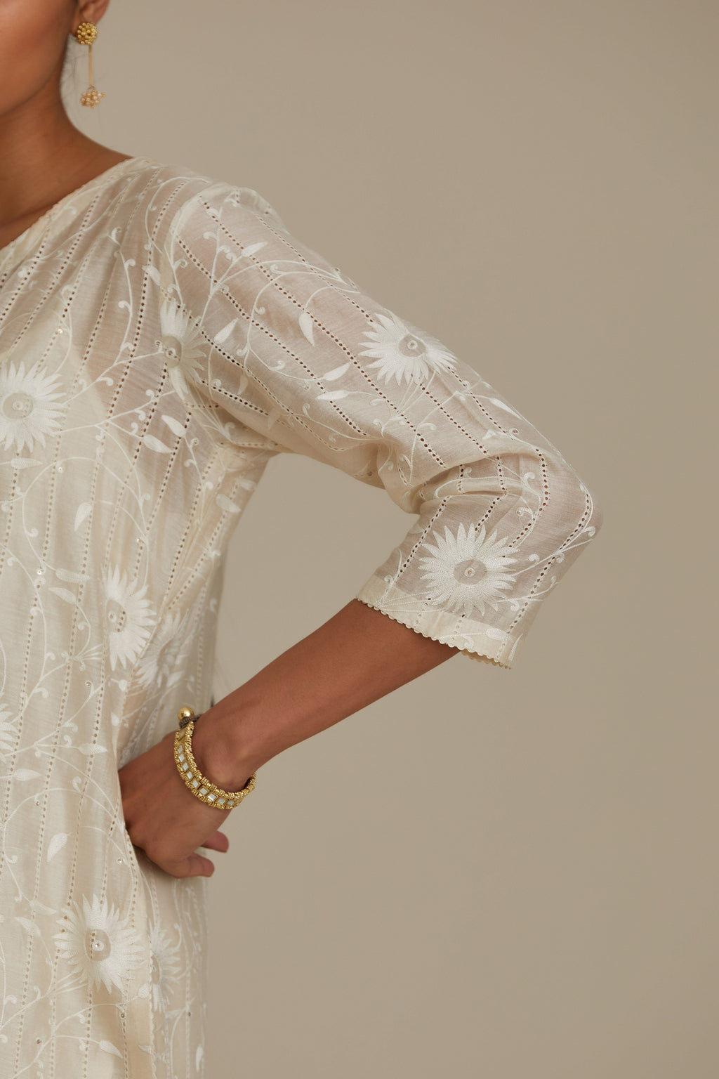 Silk chanderi straight kurta set with all-over faggoting overlayed with floral jaal threadwork, highlighted with sequins.