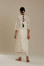 Silk chanderi straight kurta set with all-over faggoting overlayed with floral jaal threadwork, highlighted with sequins.