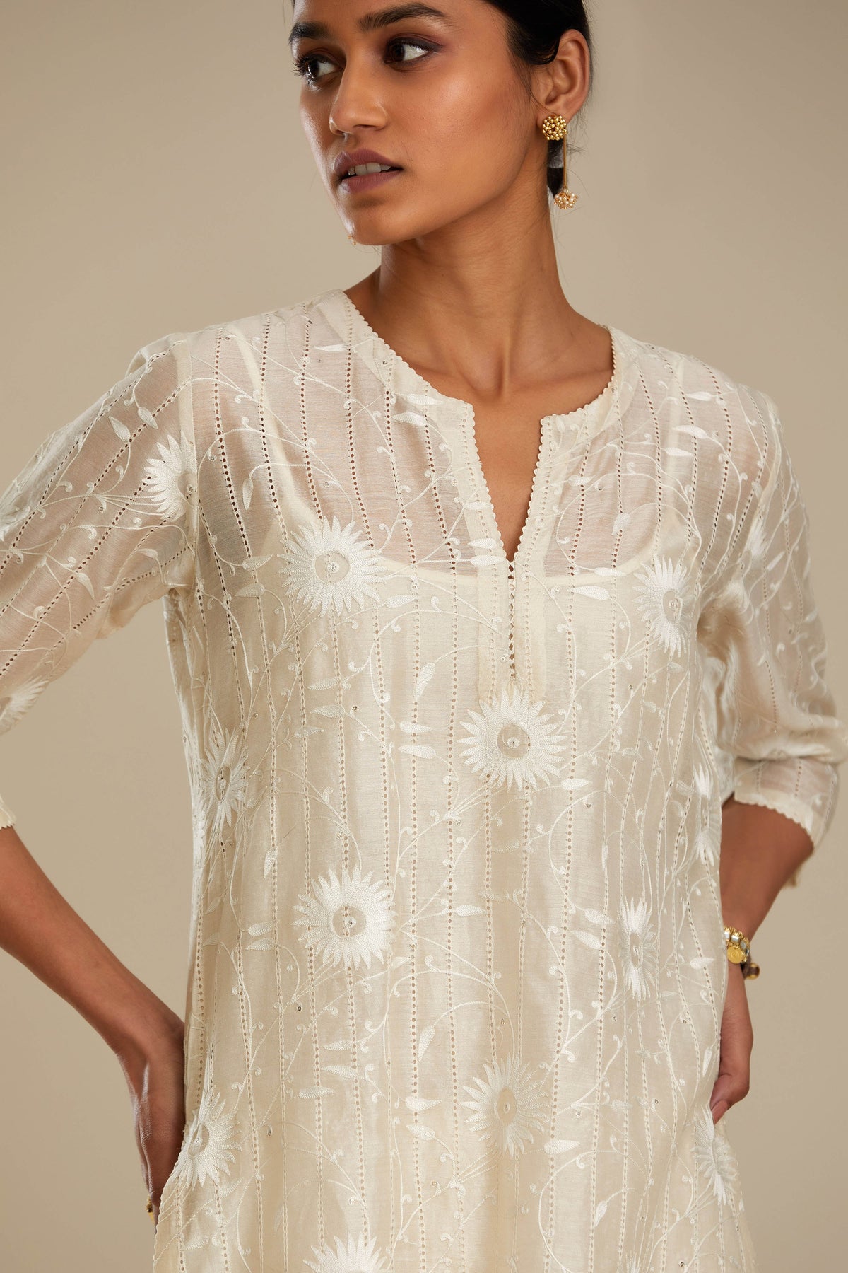 Silk chanderi straight kurta set with all-over faggoting overlayed with floral jaal threadwork, highlighted with sequins.