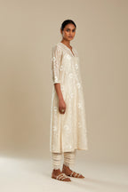 Silk chanderi straight kurta set with all-over faggoting overlayed with floral jaal threadwork, highlighted with sequins.