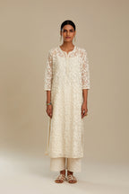 Off white silk chanderi straight kurta set with all-over leaf appliqué and sequins at edges.