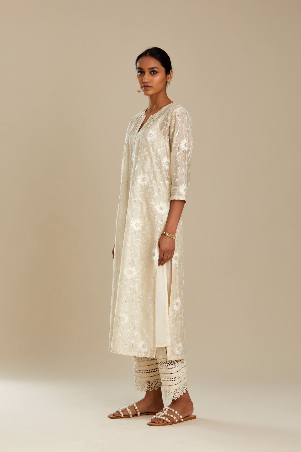 Silk chanderi straight kurta set with all-over faggoting overlayed with floral jaal threadwork, highlighted with sequins.