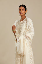 Off white silk chanderi straight kurta set with all-over leaf appliqué and sequins at edges.