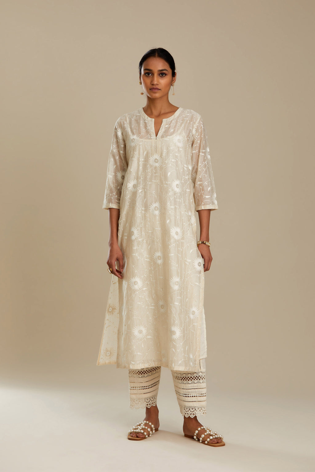 Silk chanderi straight kurta set with all-over faggoting overlayed with floral jaal threadwork, highlighted with sequins.