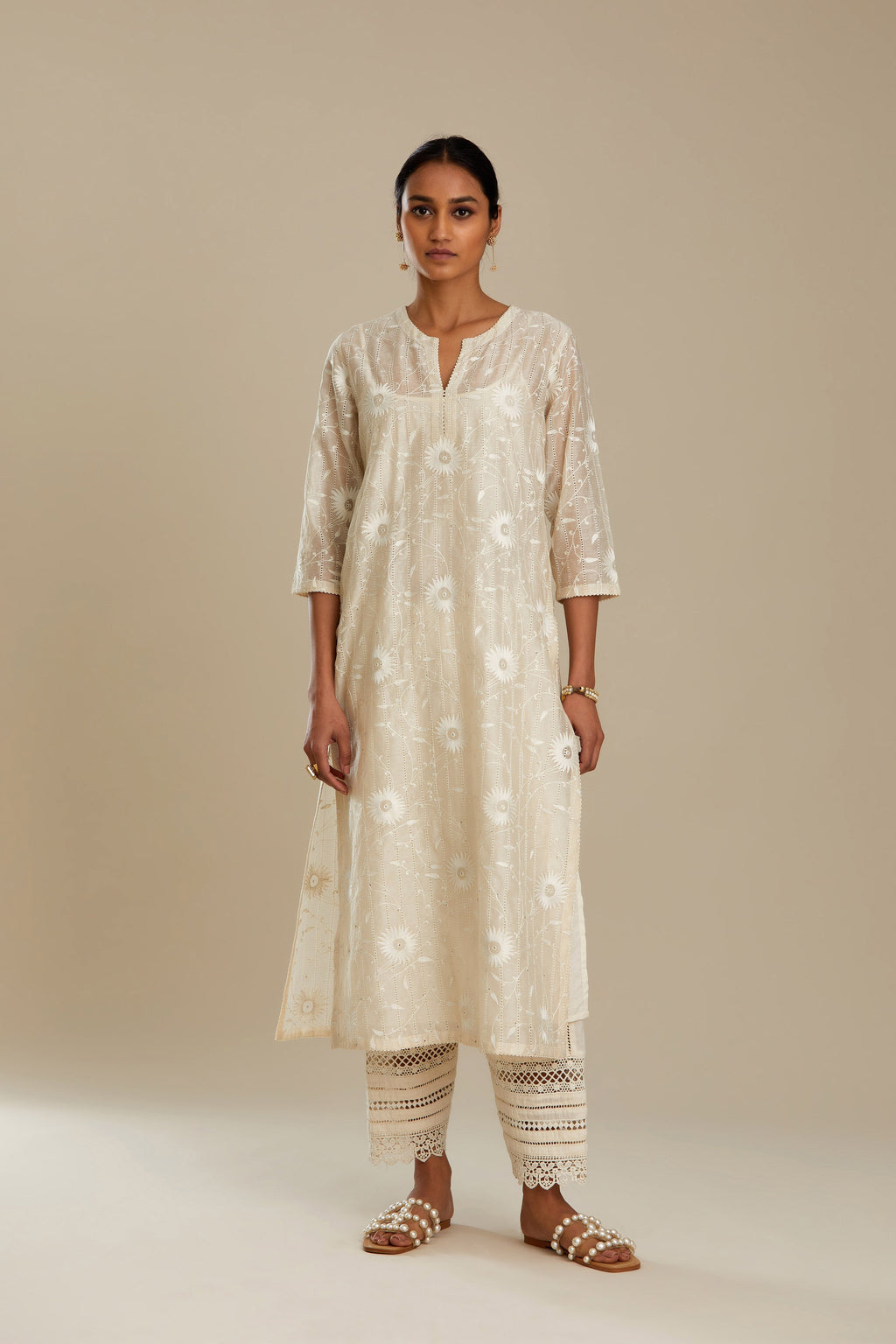 Silk chanderi straight kurta set with all-over faggoting overlayed with floral jaal threadwork, highlighted with sequins.