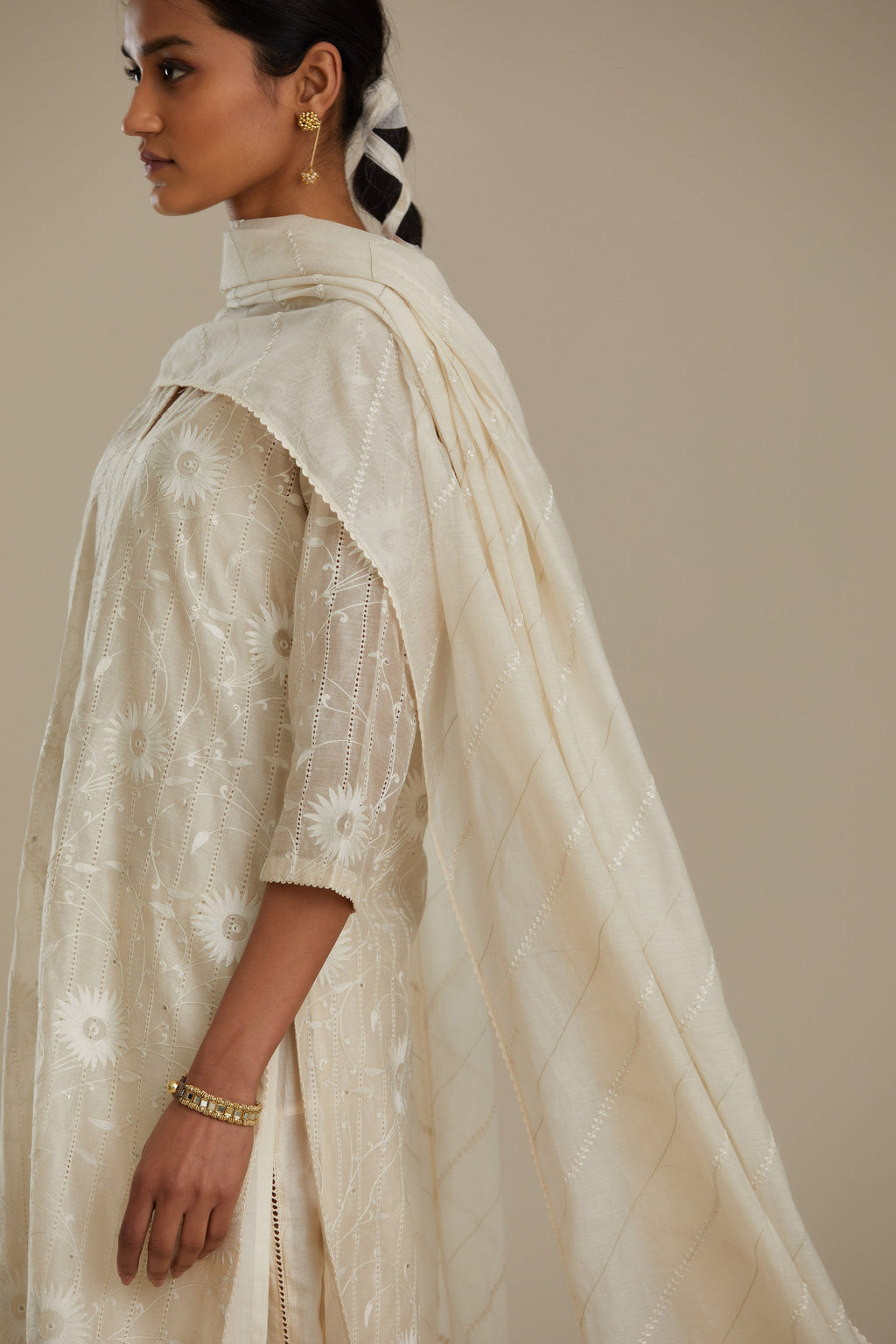 Silk chanderi straight kurta set with all-over faggoting overlayed with floral jaal threadwork, highlighted with sequins.