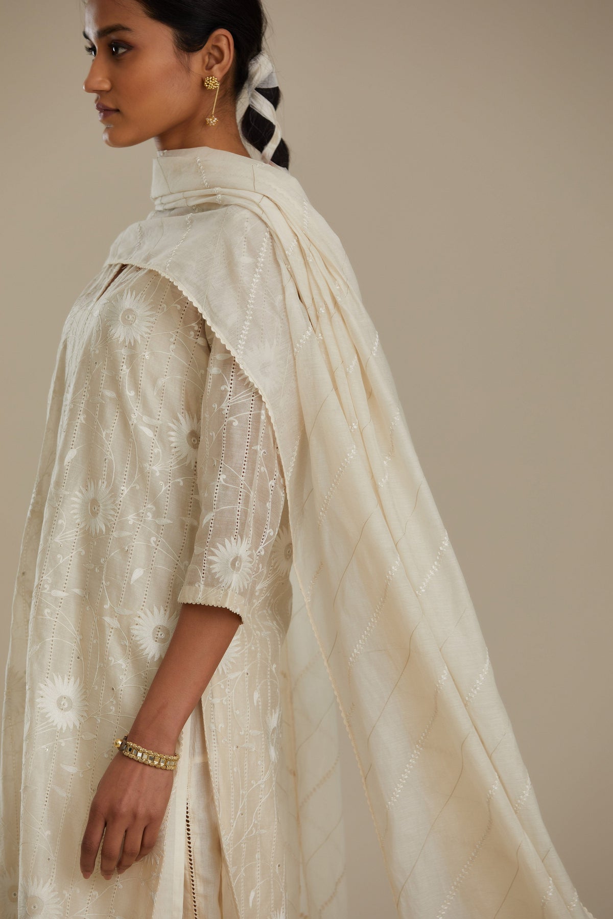 Silk chanderi straight kurta set with all-over faggoting overlayed with floral jaal threadwork, highlighted with sequins.
