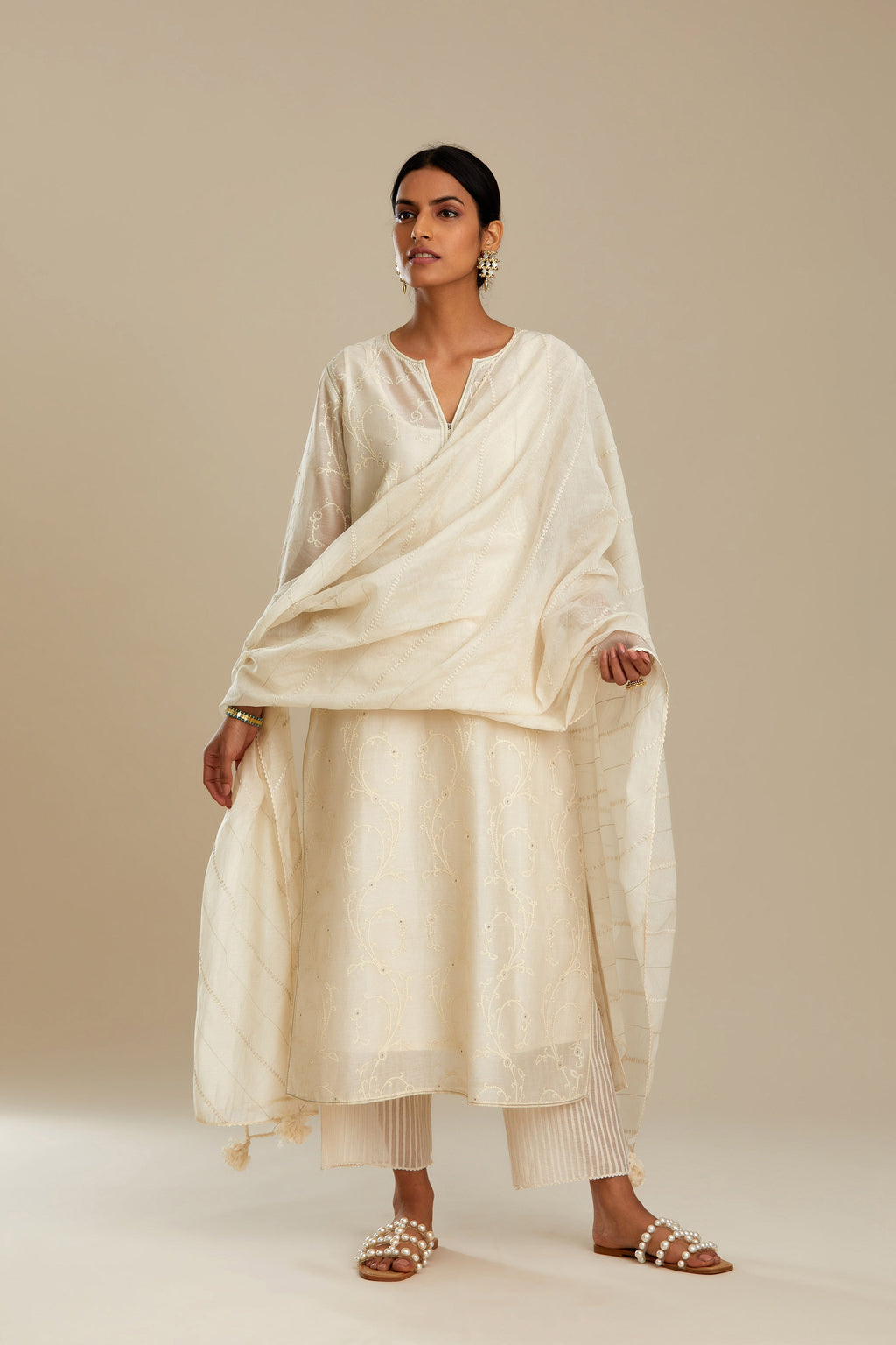 Off white silk chanderi straight kurta set with all-over tonal silk thread embroidery.