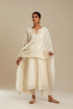 Off white silk chanderi straight kurta set with all-over tonal silk thread embroidery.