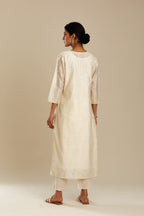 Off white silk chanderi straight kurta set with all-over tonal silk thread embroidery.