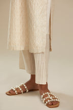Off white silk chanderi straight kurta set with all-over jharoka jaal embroidery.