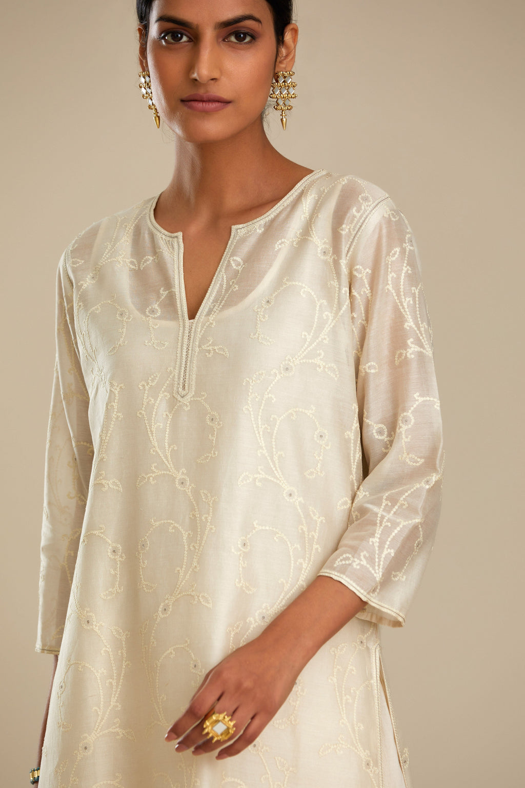 Off white silk chanderi straight kurta set with all-over tonal silk thread embroidery.