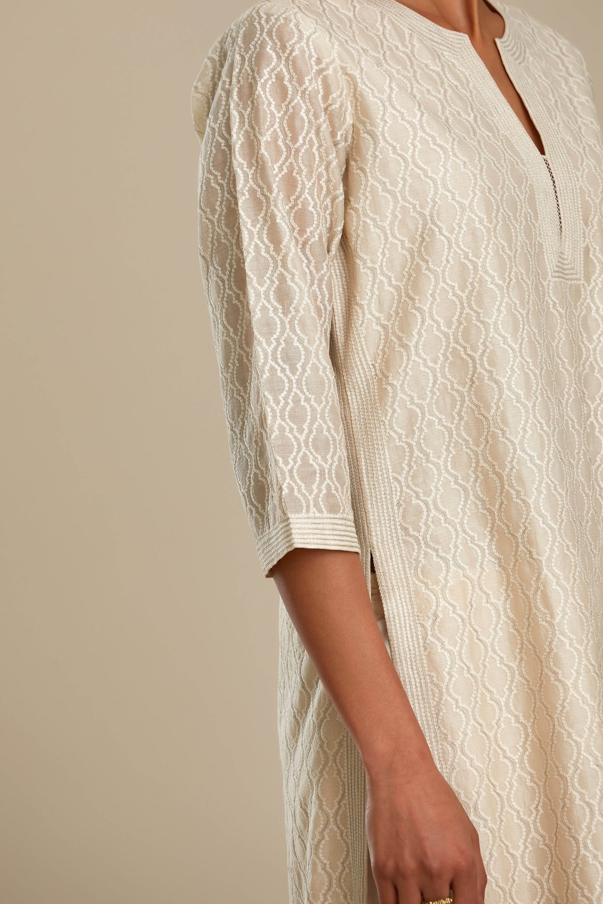Off white silk chanderi straight kurta set with all-over jharoka jaal embroidery.