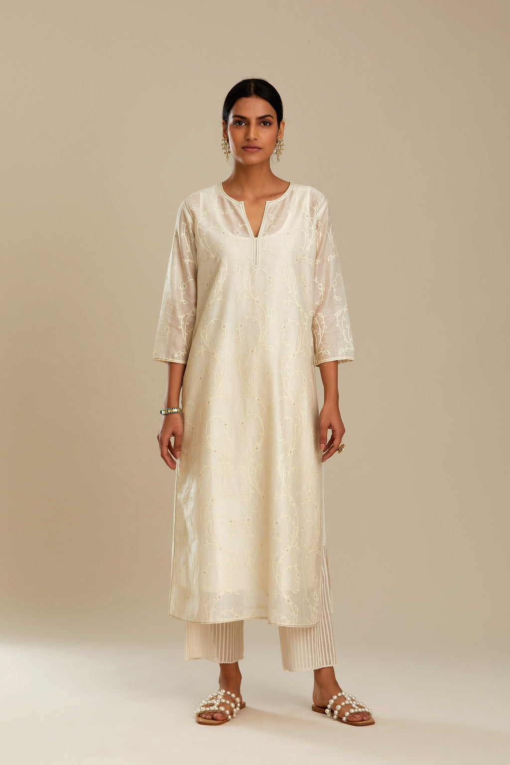 Off white silk chanderi straight kurta set with all-over tonal silk thread embroidery.