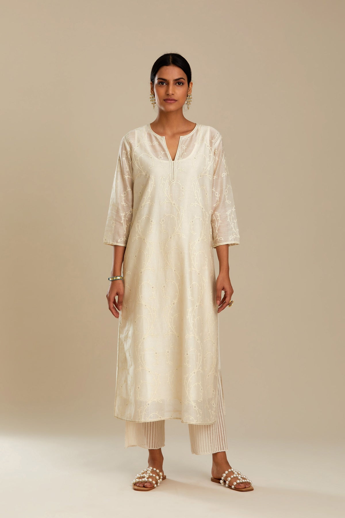 Off white silk chanderi straight kurta set with all-over tonal silk thread embroidery.