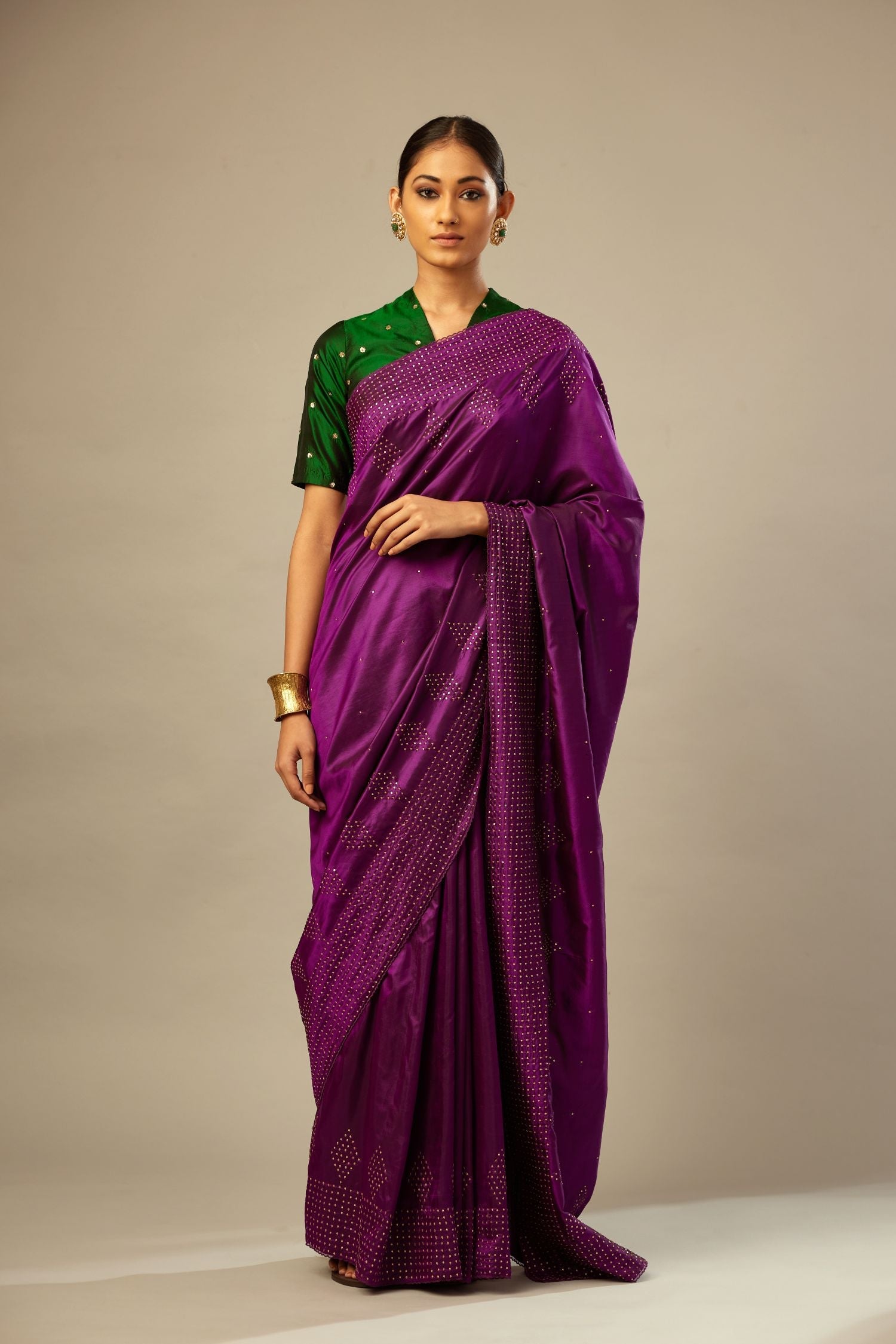 Plum purple silk saree set with a broad sequin border with diamond motifs.
