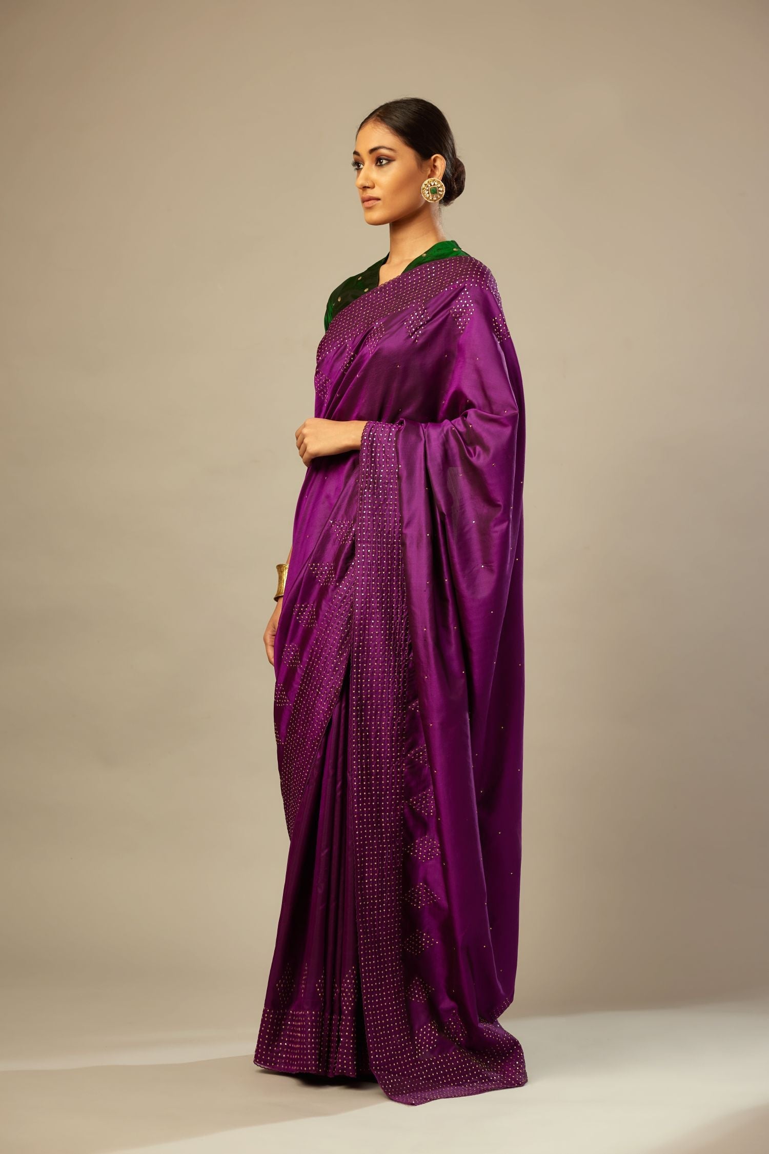 Plum purple silk saree set with a broad sequin border with diamond motifs.