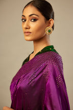 Plum purple silk saree set with a broad sequin border with diamond motifs.