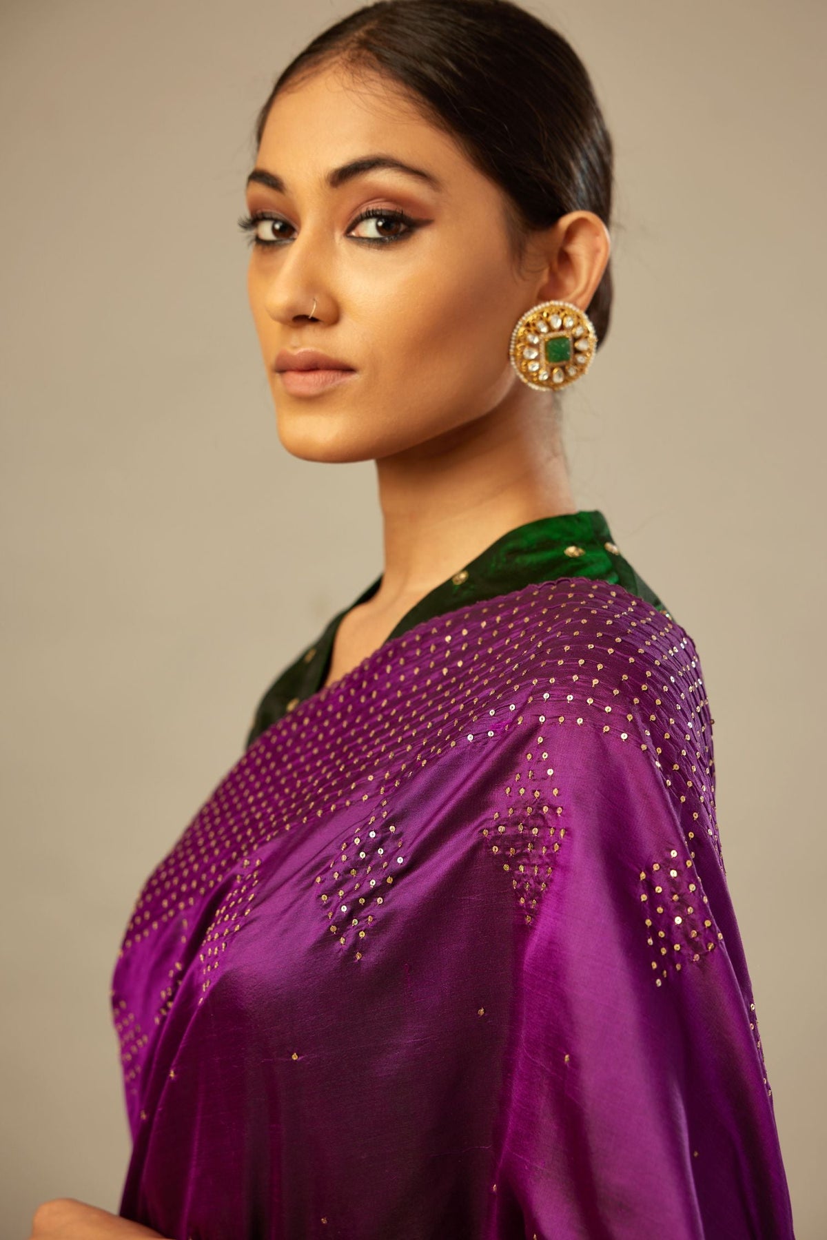 Plum purple silk saree set with a broad sequin border with diamond motifs.